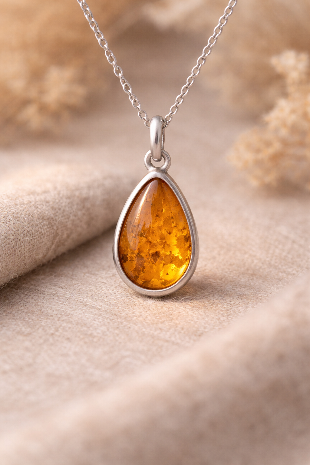 Solstice Pendant — sterling silver with amber drop